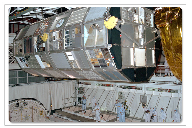After return, the satellite is removed from the Shuttle